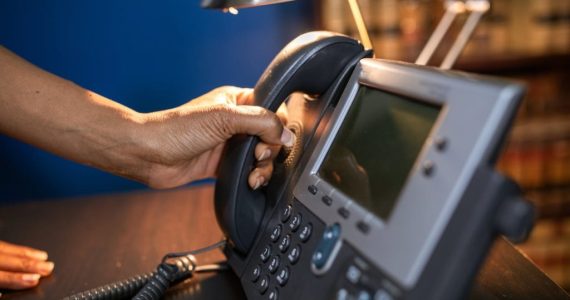 How did the invention of the telephone affect business.